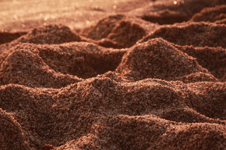 sand covered with small waves on the beach