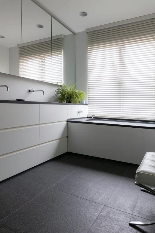 a modern white bathroom with an island sink and vanity