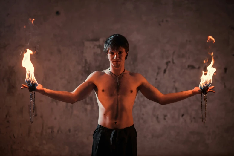 a young man with two fire hands, ready to open the room