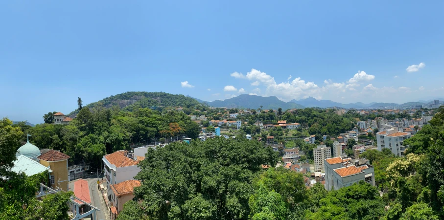 an aerial s of the city's red roofs in the daytime