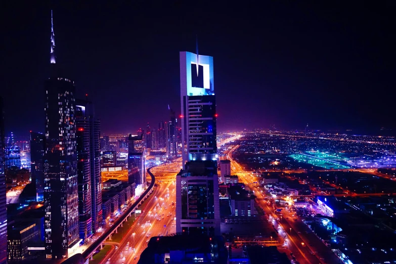 tall buildings in a city with cars on the street