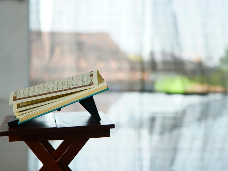 an open book is sitting on a book stand