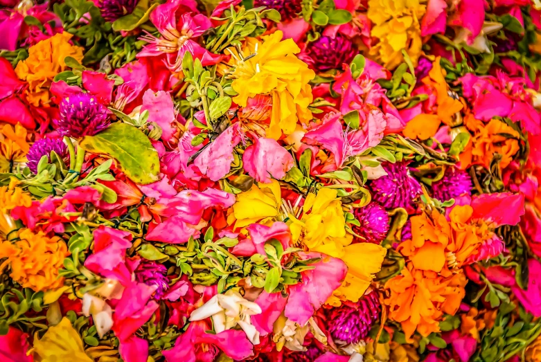 a mixture of flowers in a pile