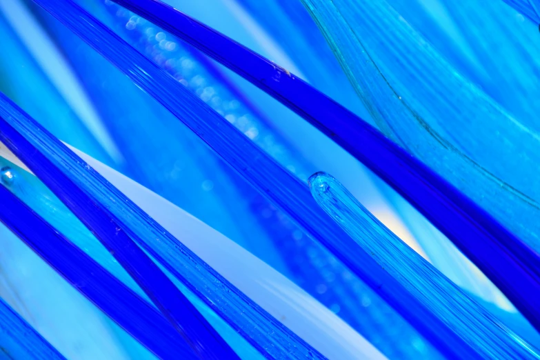 bright blue strands of glass hanging from ceiling