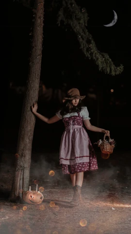 a little girl dressed in period clothes holding a basket