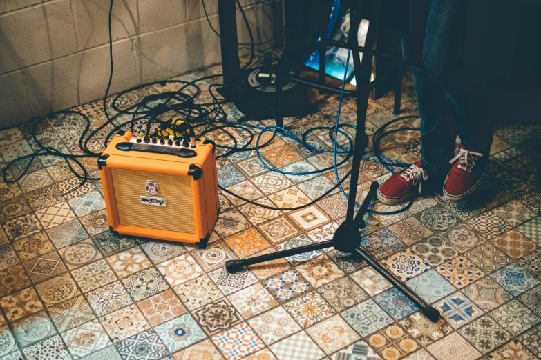 a guitar and amp equipment sitting on the ground