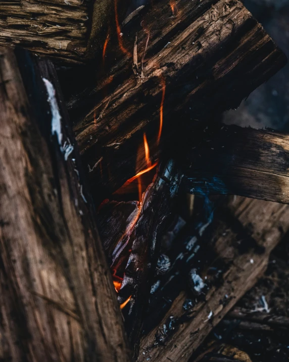wood is burn brightly in a grill