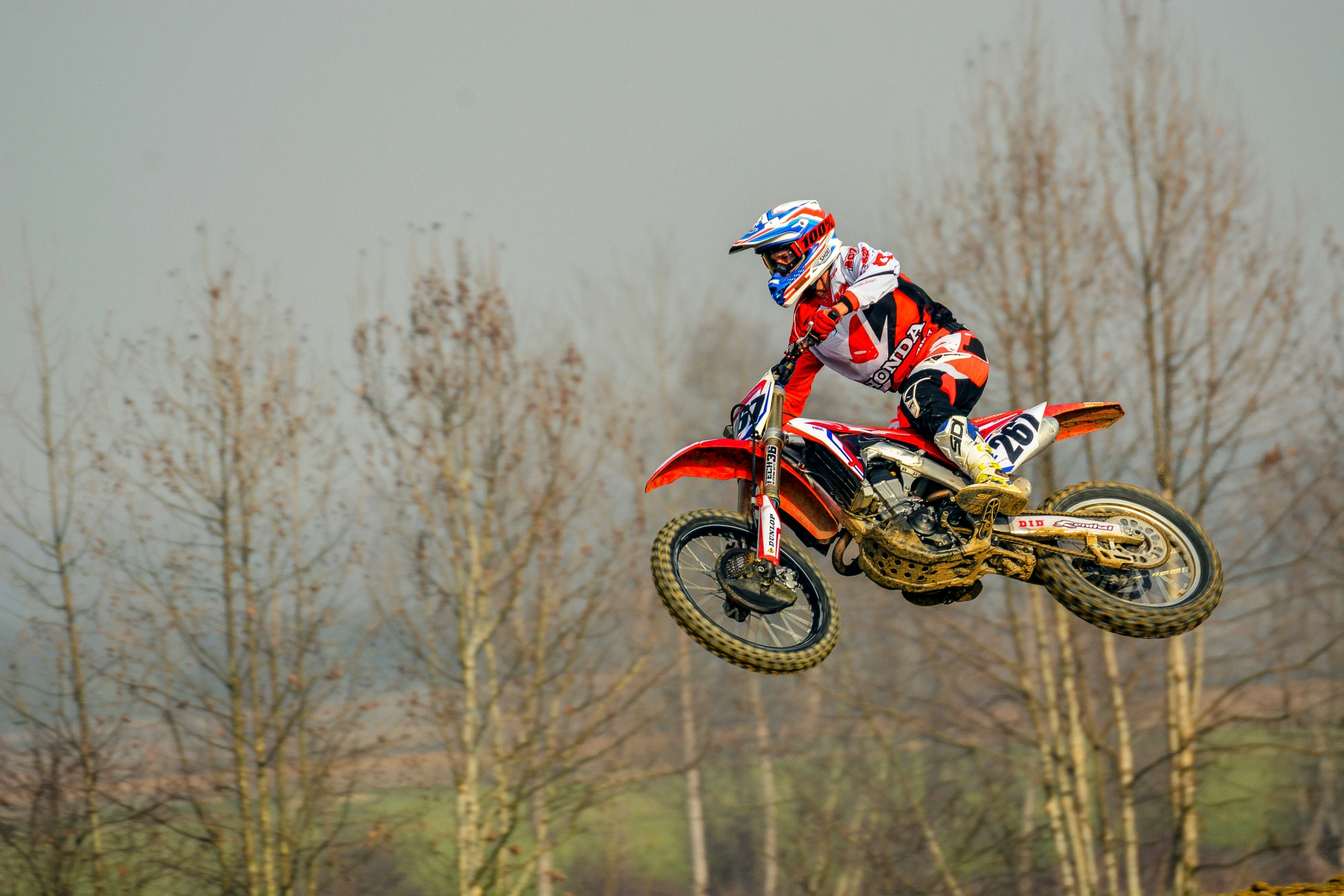 a person on a motorcycle is flying through the air