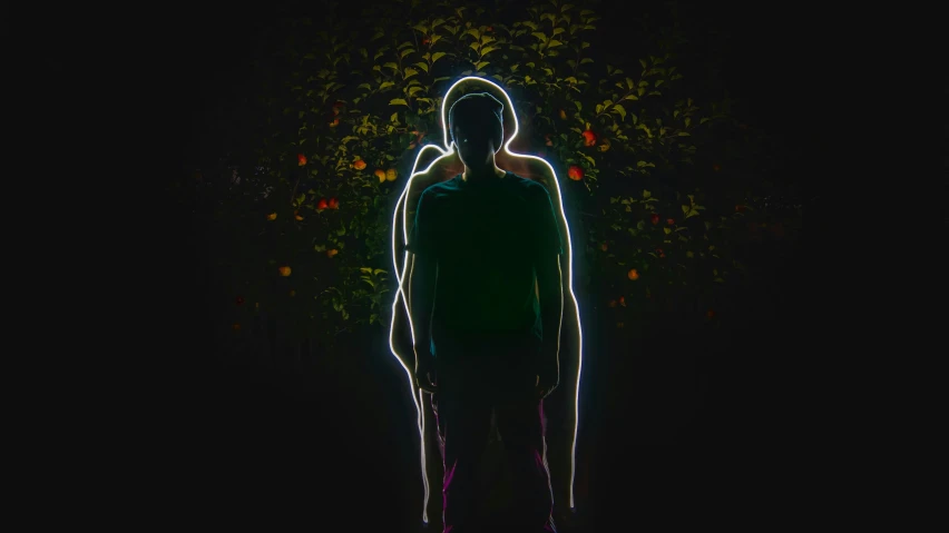 the silhouette of a man in the dark