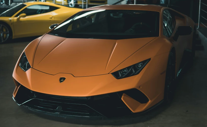 a yellow sports car in a car garage