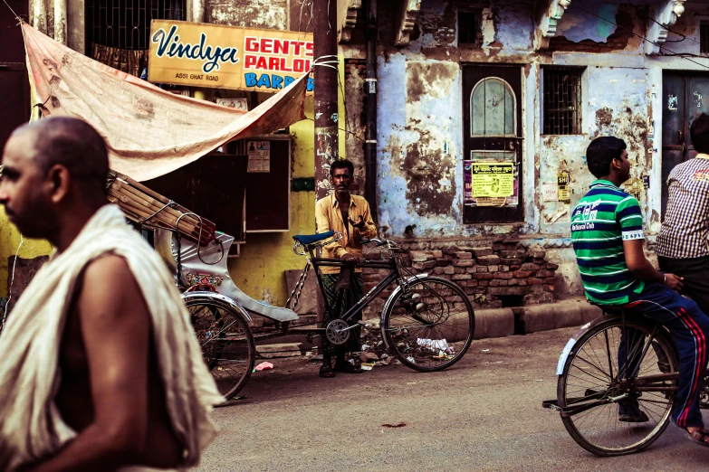 people on bicycles in the street and some of them riding