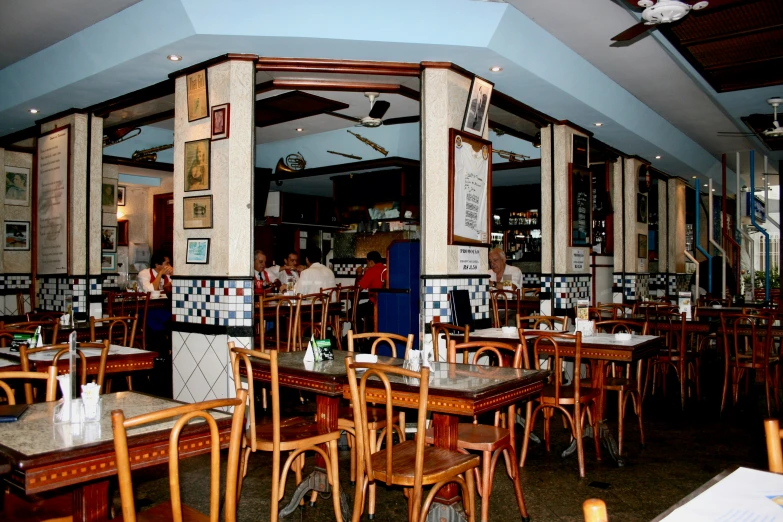 a restaurant that has been empty with wooden tables and chairs