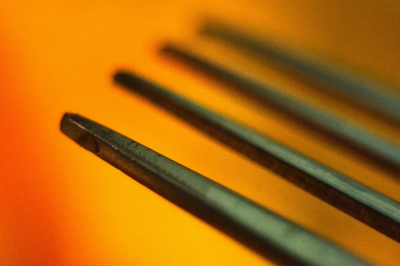 a set of four chopsticks that are bent