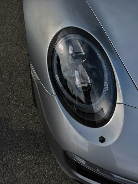 closeup of a chrome sports car headlight