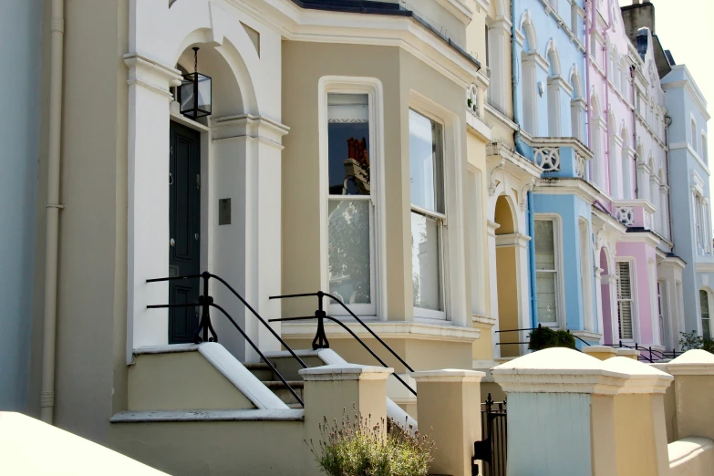 a building has several small windows with white trim