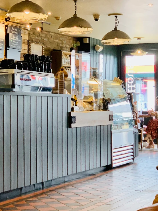 an empty restaurant with people sitting at tables