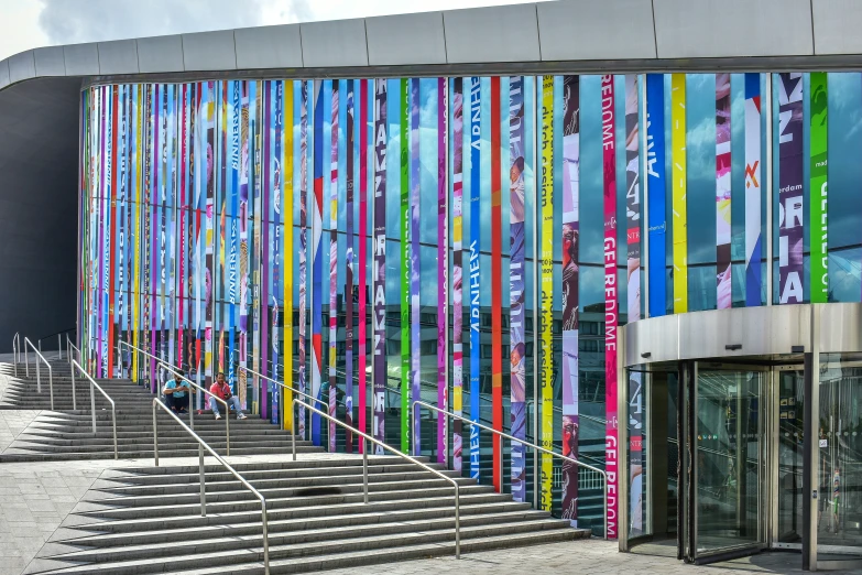 a row of colorful striped building near a walkway