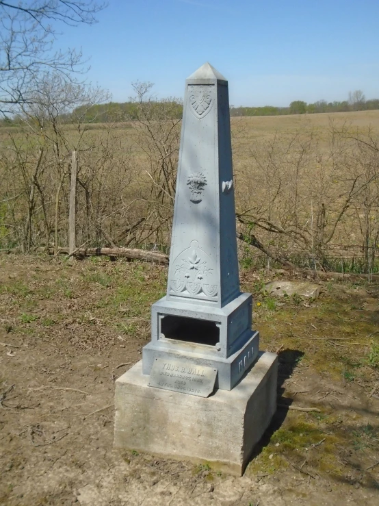 an old monument with a face etched on it