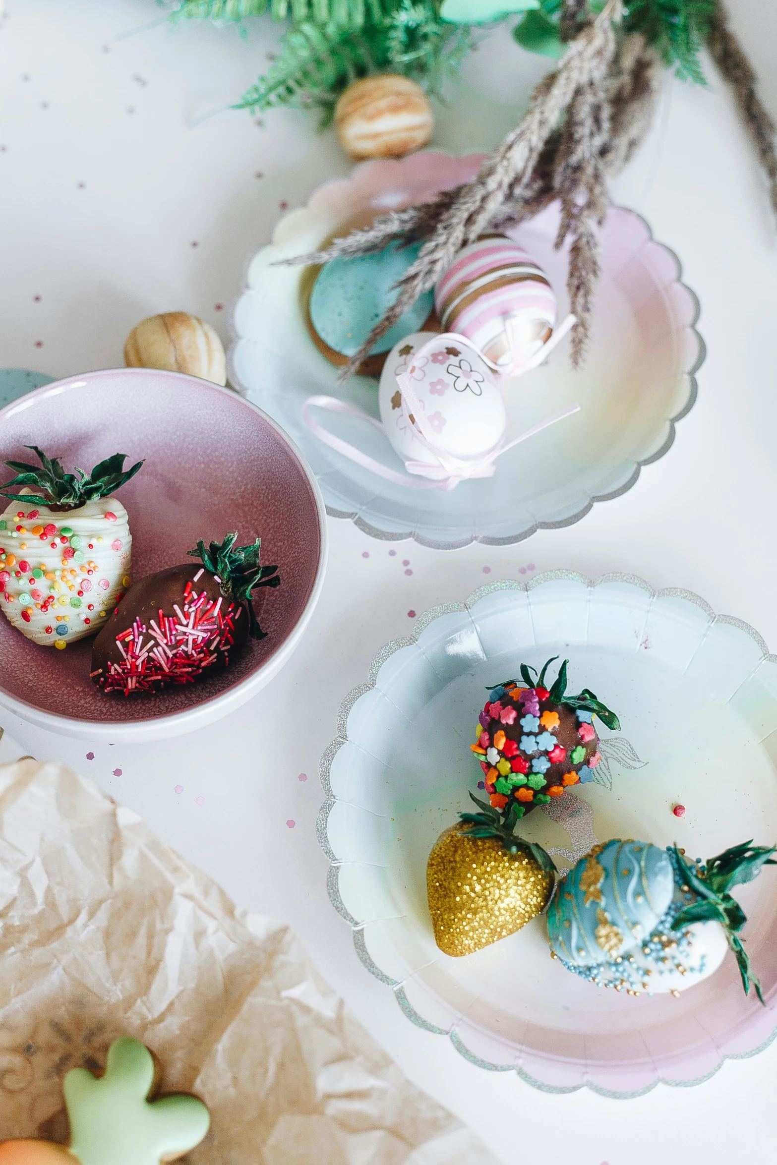 plates are shown with different decorated strawberries