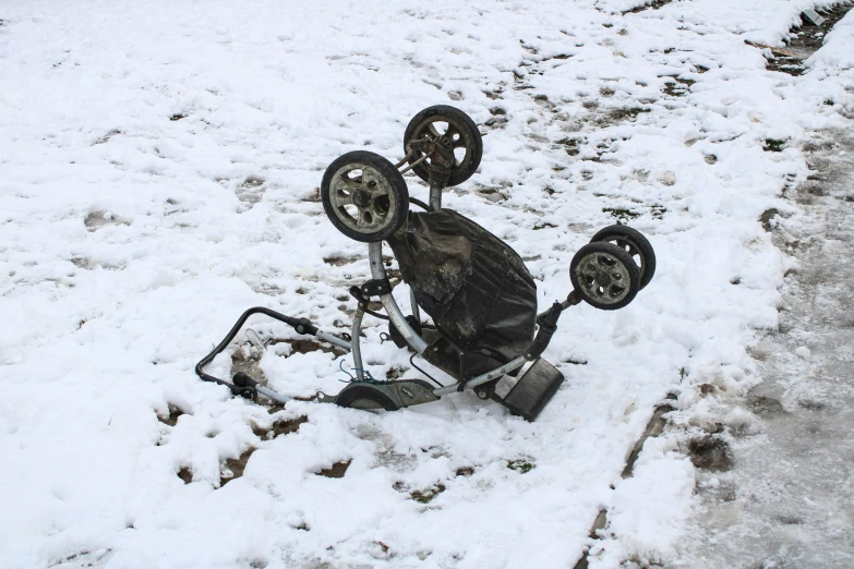 the snow covered wheels of the vehicle are all stuck in the snow