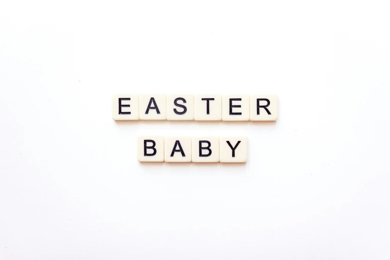 an easter baby spelled with scrabble blocks