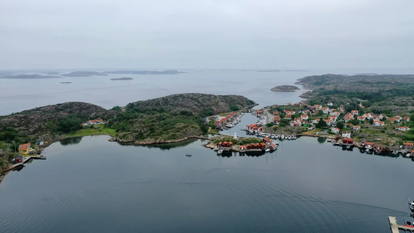 a town surrounded by lots of trees and water