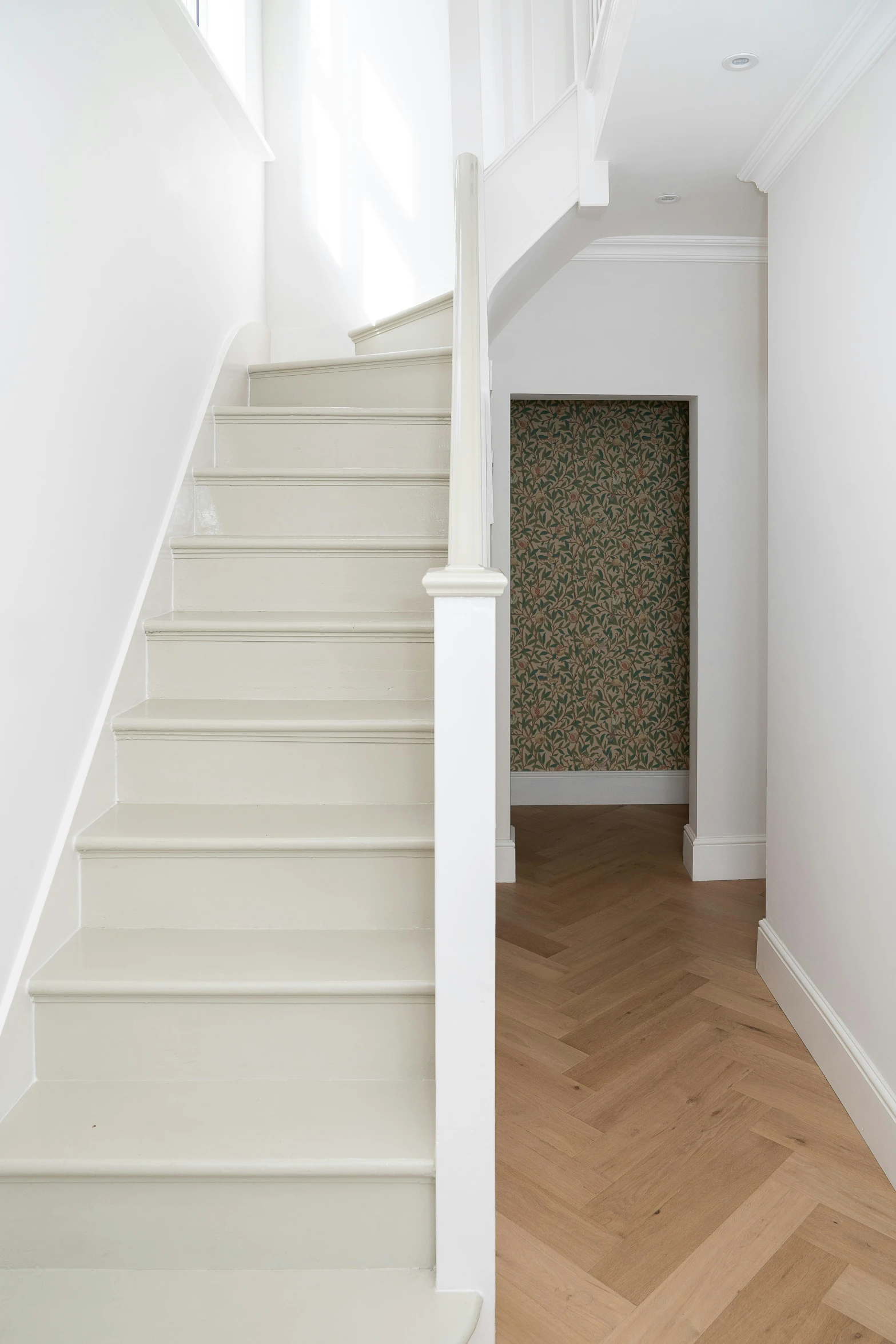 a view of a stair case next to the door