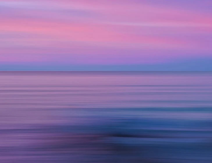 an abstract painting shows the colors of blue and pink on the water