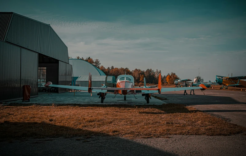 an air plane parked in front of a building