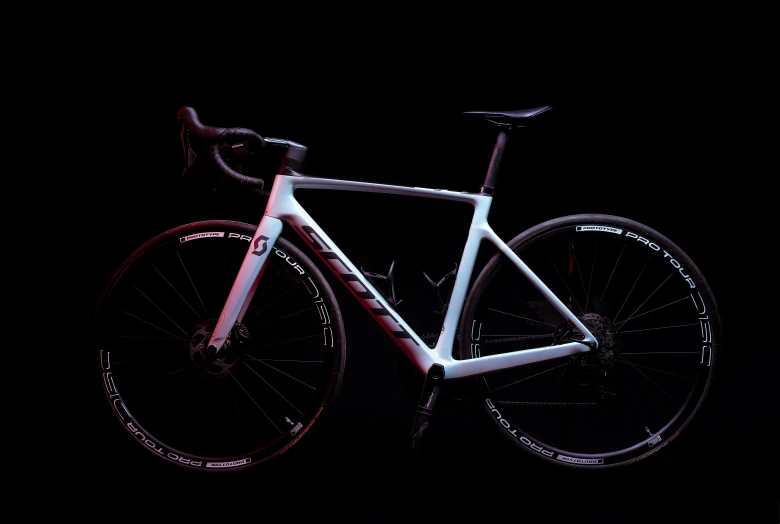 a close up of a bicycle on a dark surface