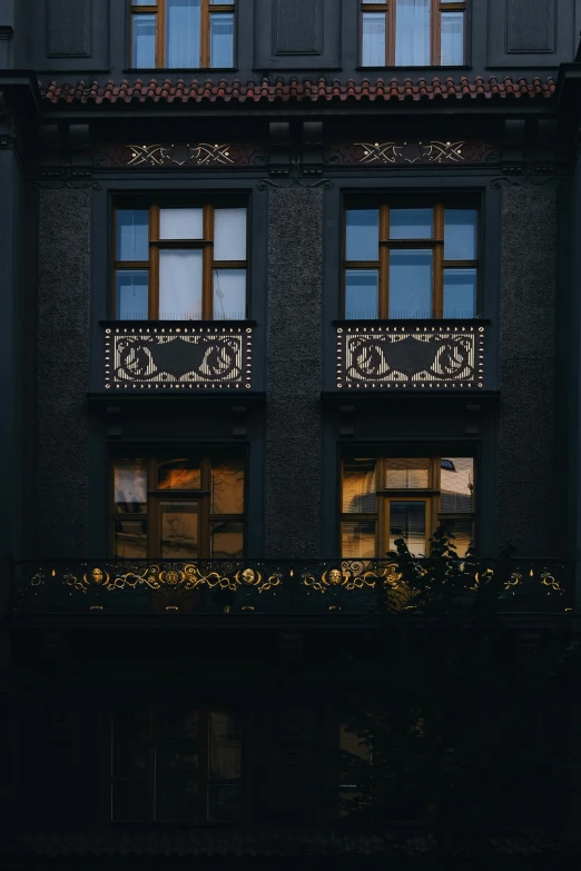 an old building with windows lit up at night