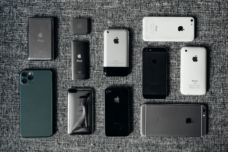 several iphones, one is white and black and two are blue