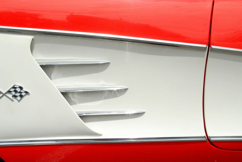 a close up of a red and white car