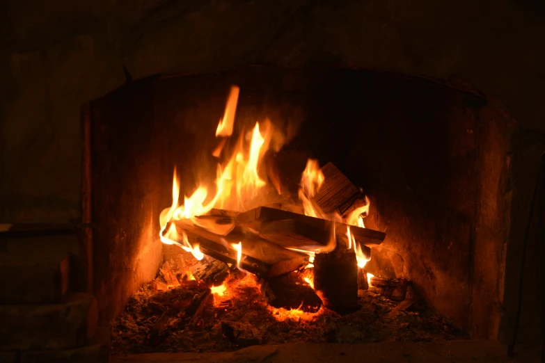 a fireplace is shown with fire going out