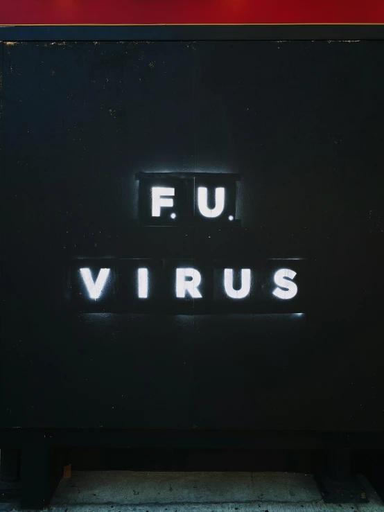a sign reading fu viruss on a red wall