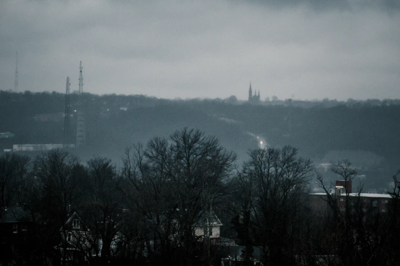 the view of city in the distance with dark clouds