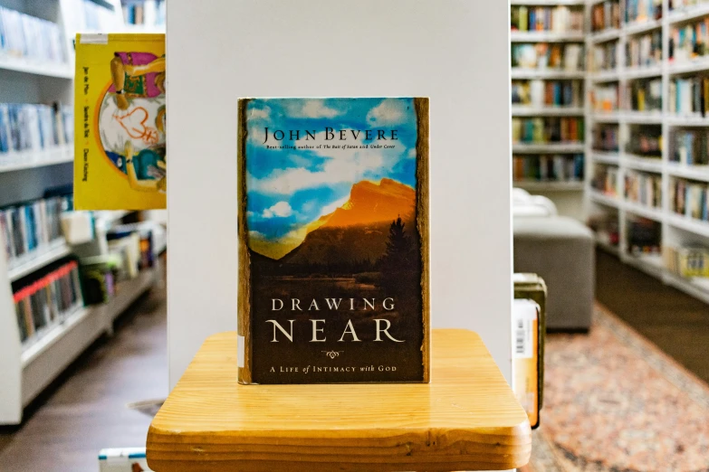 a book on a wooden table in a liry