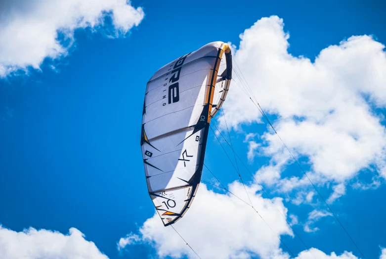 a white and black sail on the blue sky
