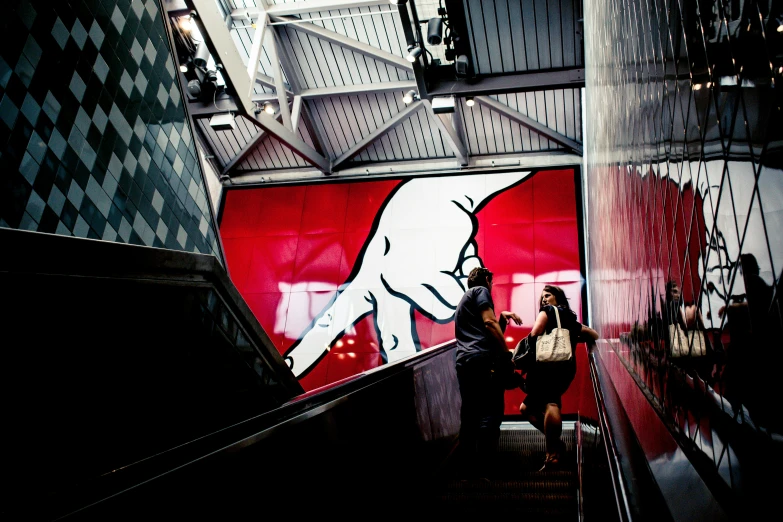 a couple of people walking up some steps