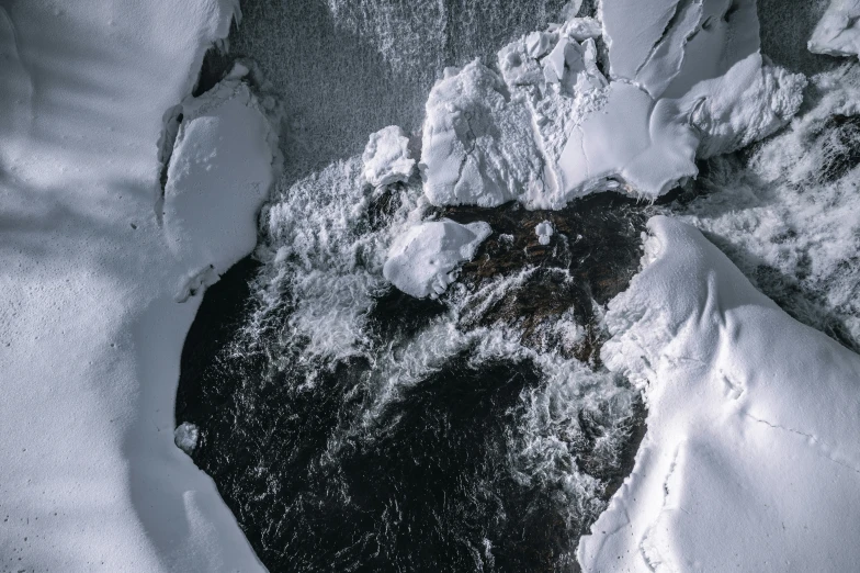 black and white pograph of snow and rocks