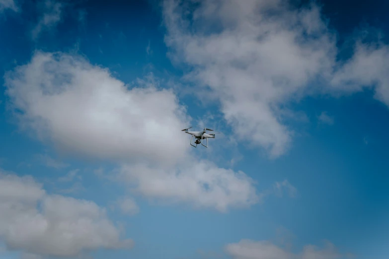 a small plane flying high up in the sky