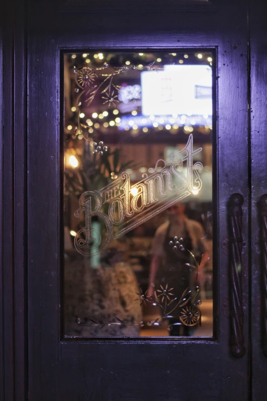 a wooden door has the word potato's written on it