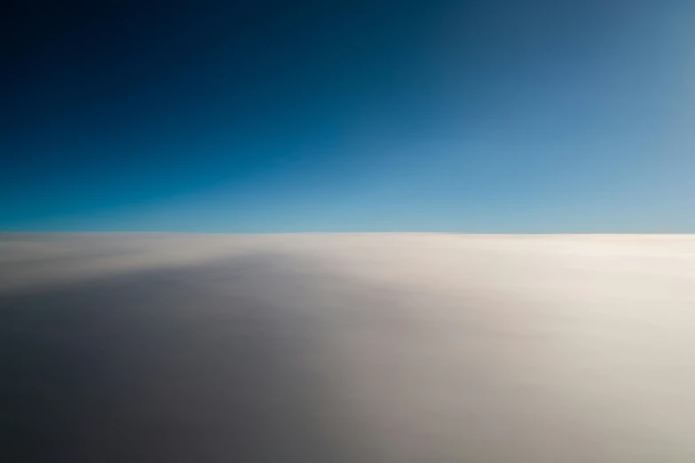 a white expanse surrounded by blue sky and white clouds