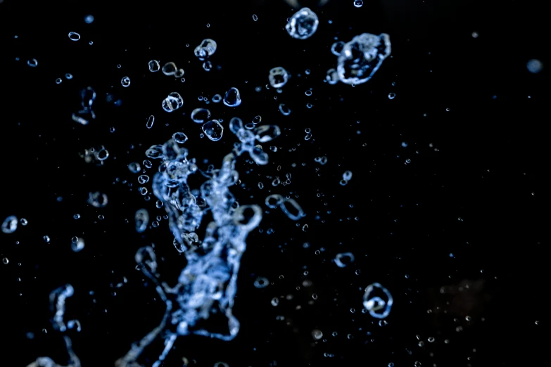water bubbles are falling and then being released in the air