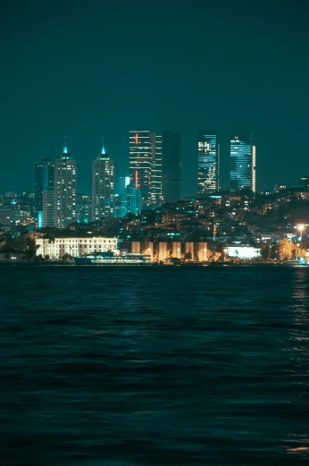 an image of city skyline at night taken from the water