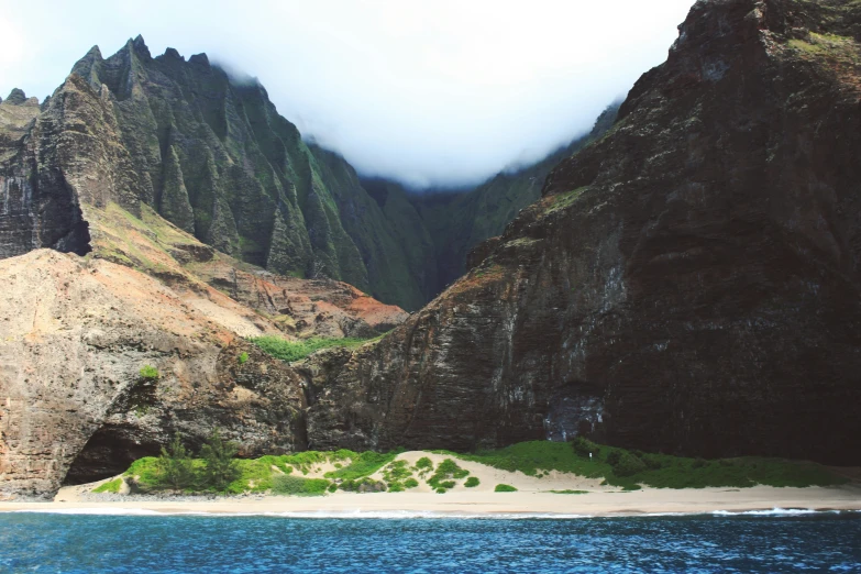 the mountains are very tall above the water