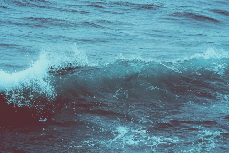 a blue ocean with waves in the water