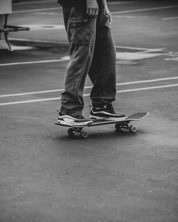 a man is standing on top of his skateboard