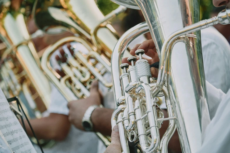 the ss section of a trumpet is in focus as it plays