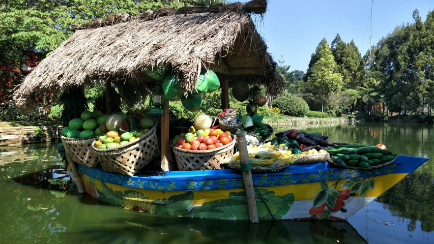 there is an outdoor fruit and vegetable market on the water